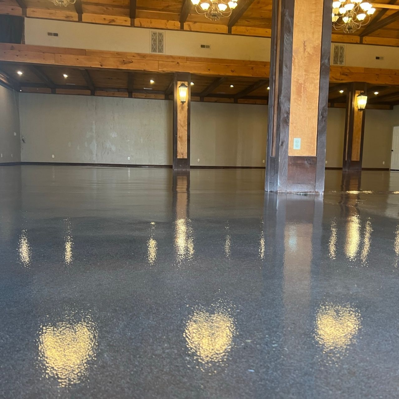 Event venue floor coating with stone fireplace Missouri